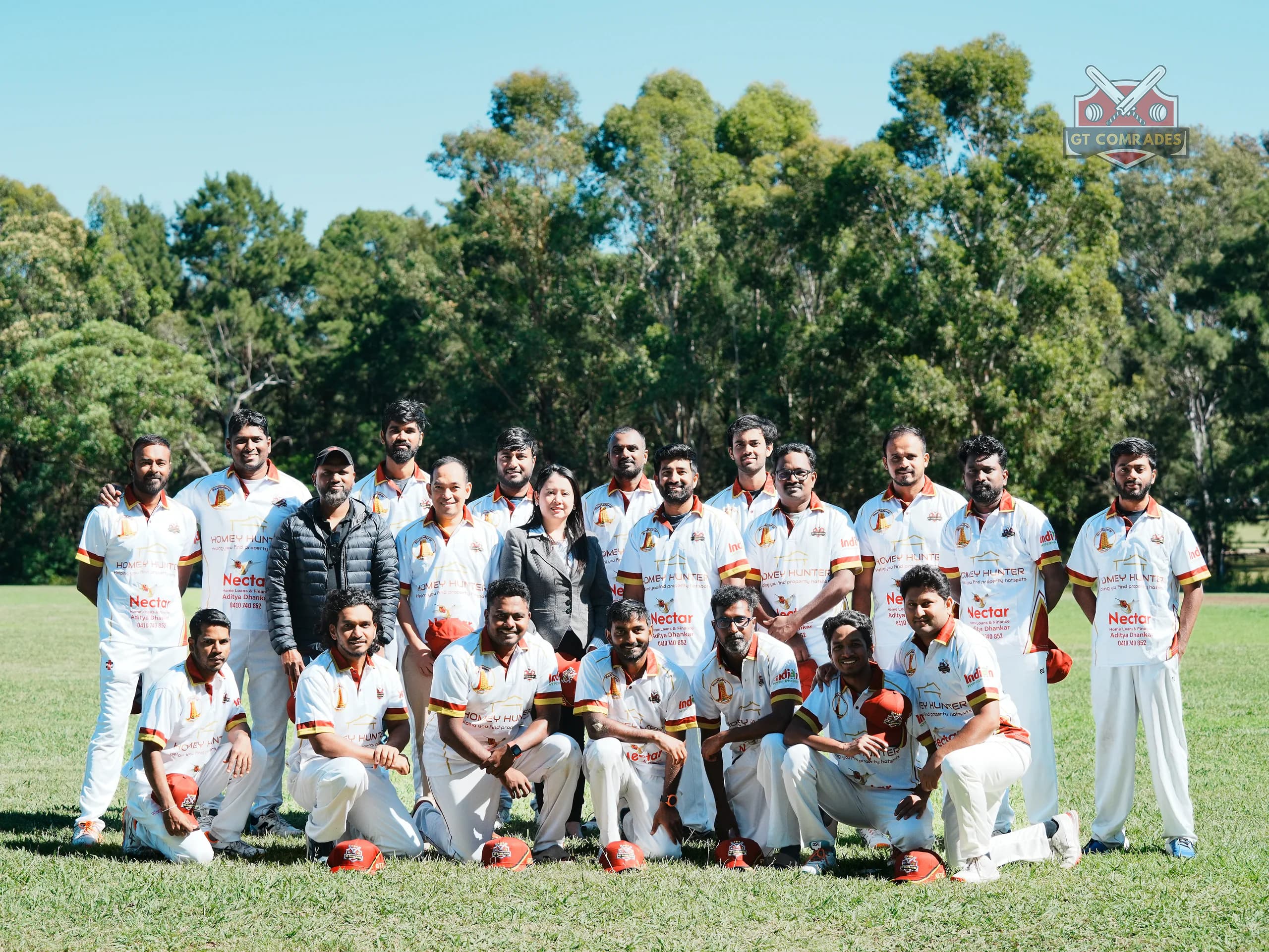 GT Comrades Cricket Club players gathered on a cricket ground